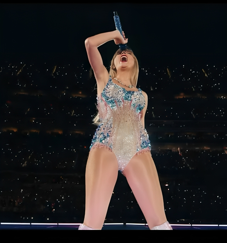 Taylor Swift sharing heartfelt messages with fans during her 'Eras Tour' concert, connecting with the audience